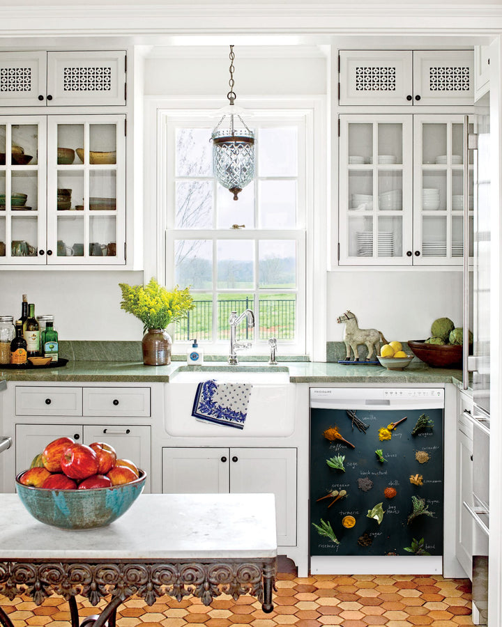 Kitchen with White Cabinets Green Countertop Terra Cotta Floor Kitchen Sink with Window next to Herbs & Spices Magnetic Dishwasher Cover Skin on Dishwasher with White Control Panel
