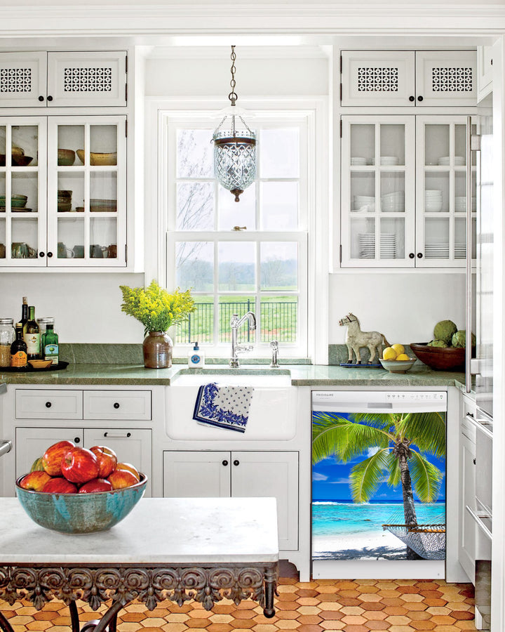 Kitchen with White Cabinets Green Countertop Terra Cotta Floor Kitchen Sink with Window next to Perfect Palm Tree Magnet Skin on Dishwasher with White Control Panel