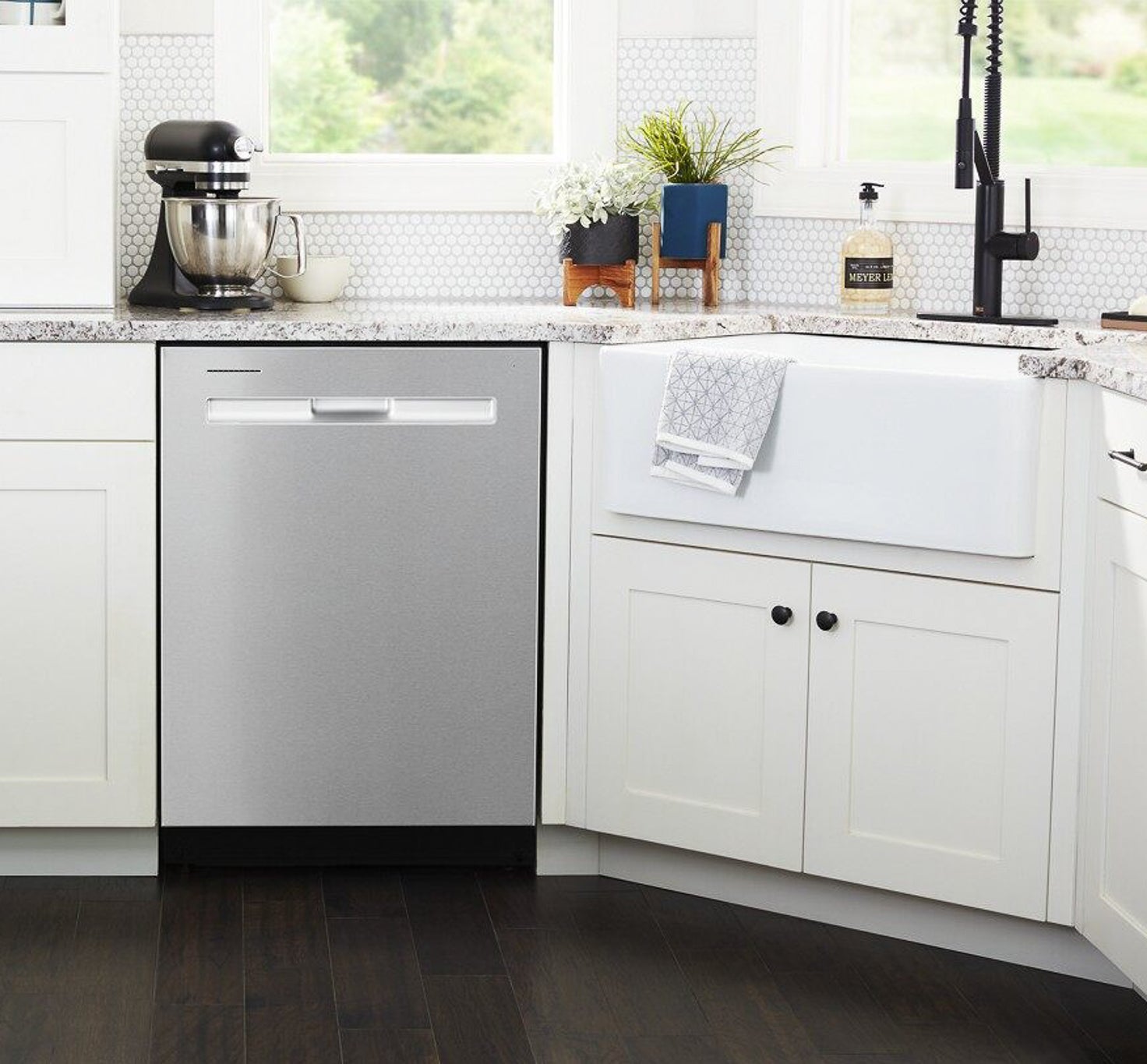 magnetic non brushed stainless steel magnet cover on dishwasher inserted white cabinets next to kitchen sink
