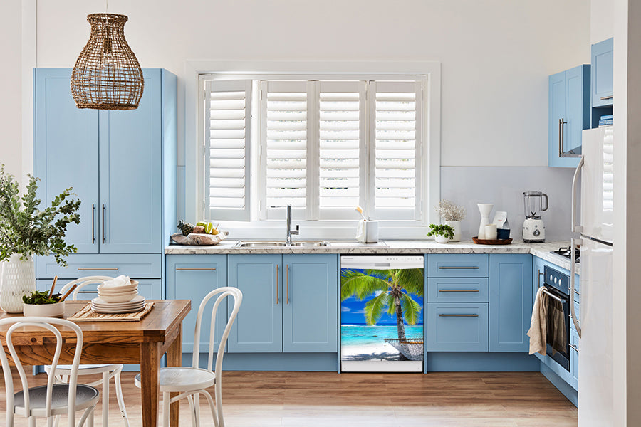 Breakfast table in kitchen with white walls, blue cabinets, marble countertop large window over sink area perfect palm tree magnet skin on dishwasher white control panel