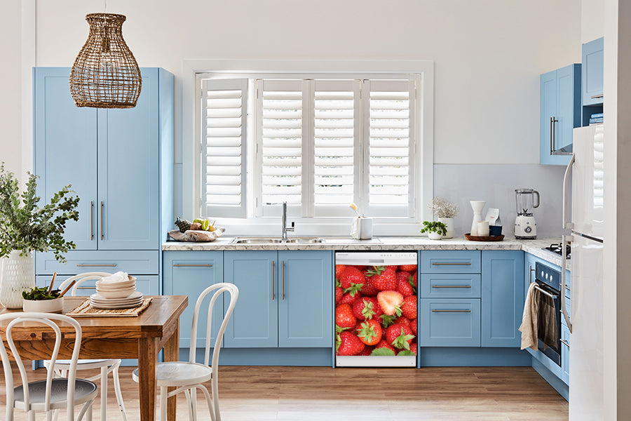 Breakfast table in kitchen with white walls, blue cabinets, marble countertop large window over sink area sweet strawberries magnet skin on dishwasher white control panel