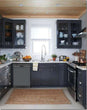 Load image into Gallery viewer, Dark Gray Kitchen Cabinets with White Marble Countertop Against White Walls Window Behind Sink Battleship Gray Magnet Skin on Dishwasher Black Control Panel
