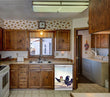 Load image into Gallery viewer, Kitchen Brown Wood Cabinets Recessed Stove &amp; Oven Chickens on the Run Magnet Skin on Dishwasher White Control Panel Next to Sink
