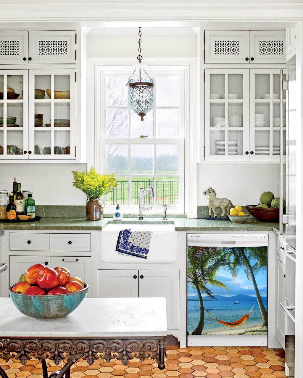 Kitchen with White Cabinets Green Countertop Terra Cotta Floor Kitchen Sink with Window next to Beach Hammock Magnet Skin on Dishwasher with White Control Panel
