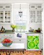 Load image into Gallery viewer, Kitchen with White Cabinets Green Countertop Terra Cotta Floor Kitchen Sink with Window next to Fresh Limes Magnet Skin on Dishwasher with White Control Panel
