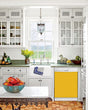 Load image into Gallery viewer, Kitchen with White Cabinets Green Countertop Terra Cotta Floor Kitchen Sink with Window next to Scoolbus Yellow Magnet Skin on Dishwasher with White Control Panel
