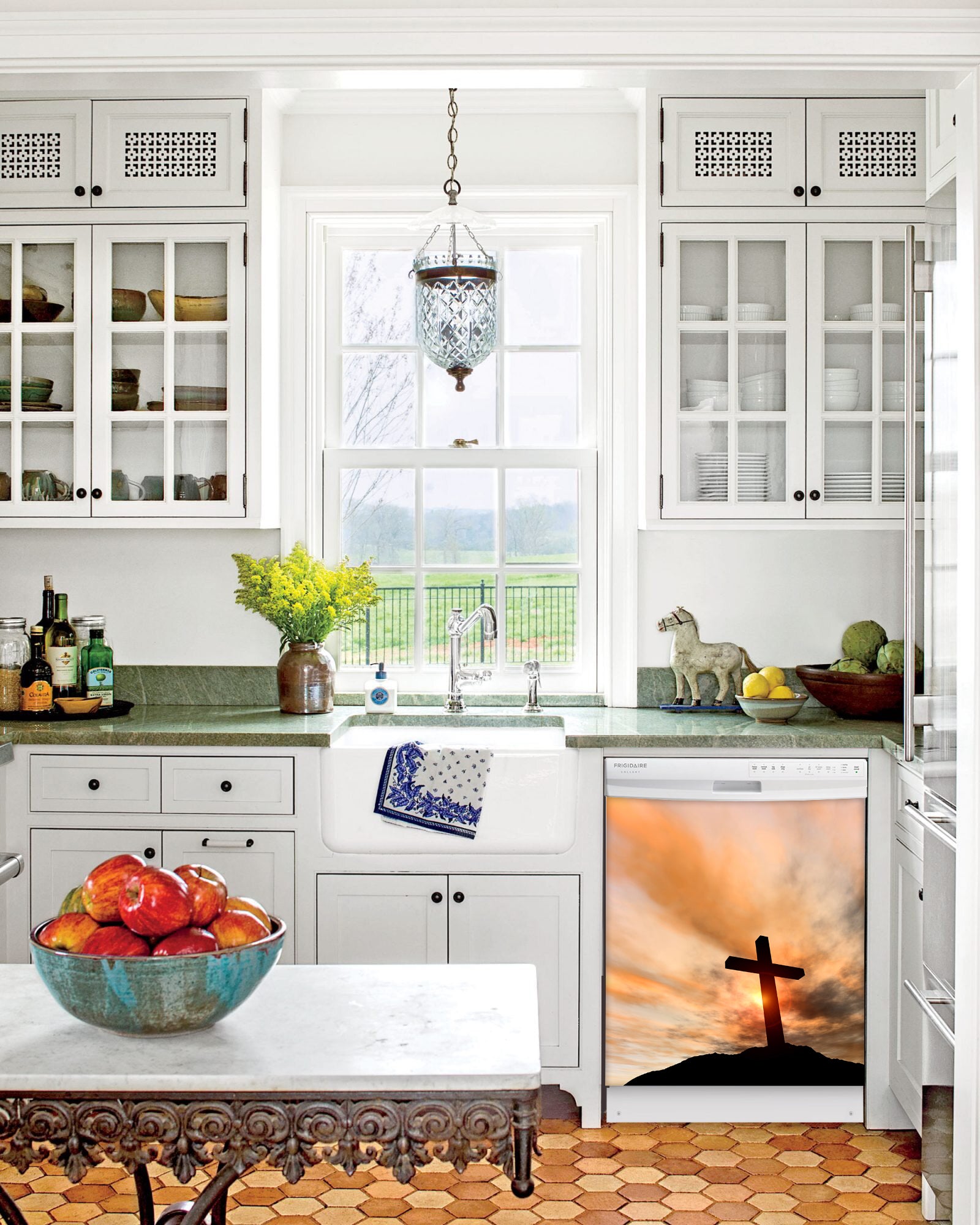 Kitchen with White Cabinets Green Countertop Terra Cotta Floor Kitchen Sink with Window next to Sunrise Cross Inspiration Magnet Skin on Dishwasher with White Control Panel