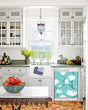 Load image into Gallery viewer, Kitchen with White Cabinets Green Countertop Terra Cotta Floor Kitchen Sink with Window next to White Magnolias Magnet Skin on Dishwasher with White Control Panel
